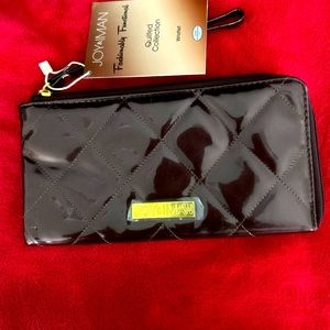 Joy & Iman Wristlet, Black, zippered & card slots, 9 1/4 length and 5” width.